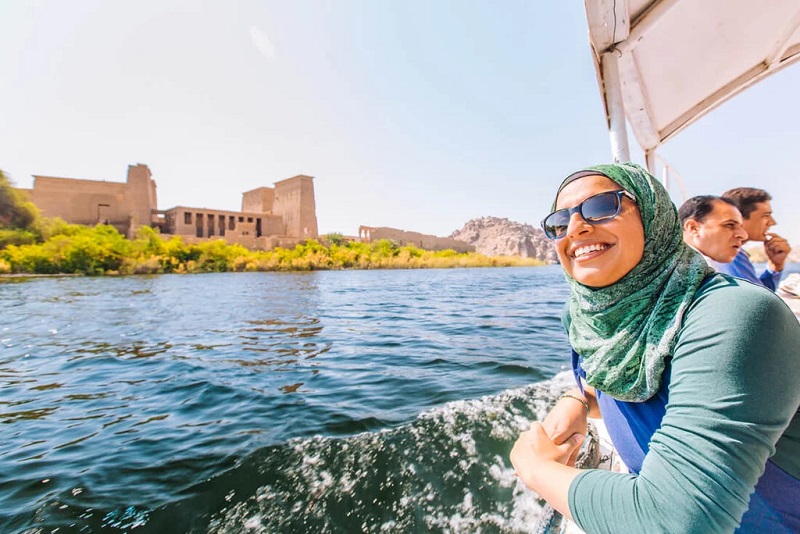 Aswan Woman enjoying a sunny day on a boat in Aswan
